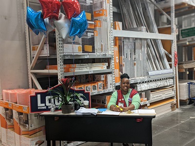 table with employee and balloons